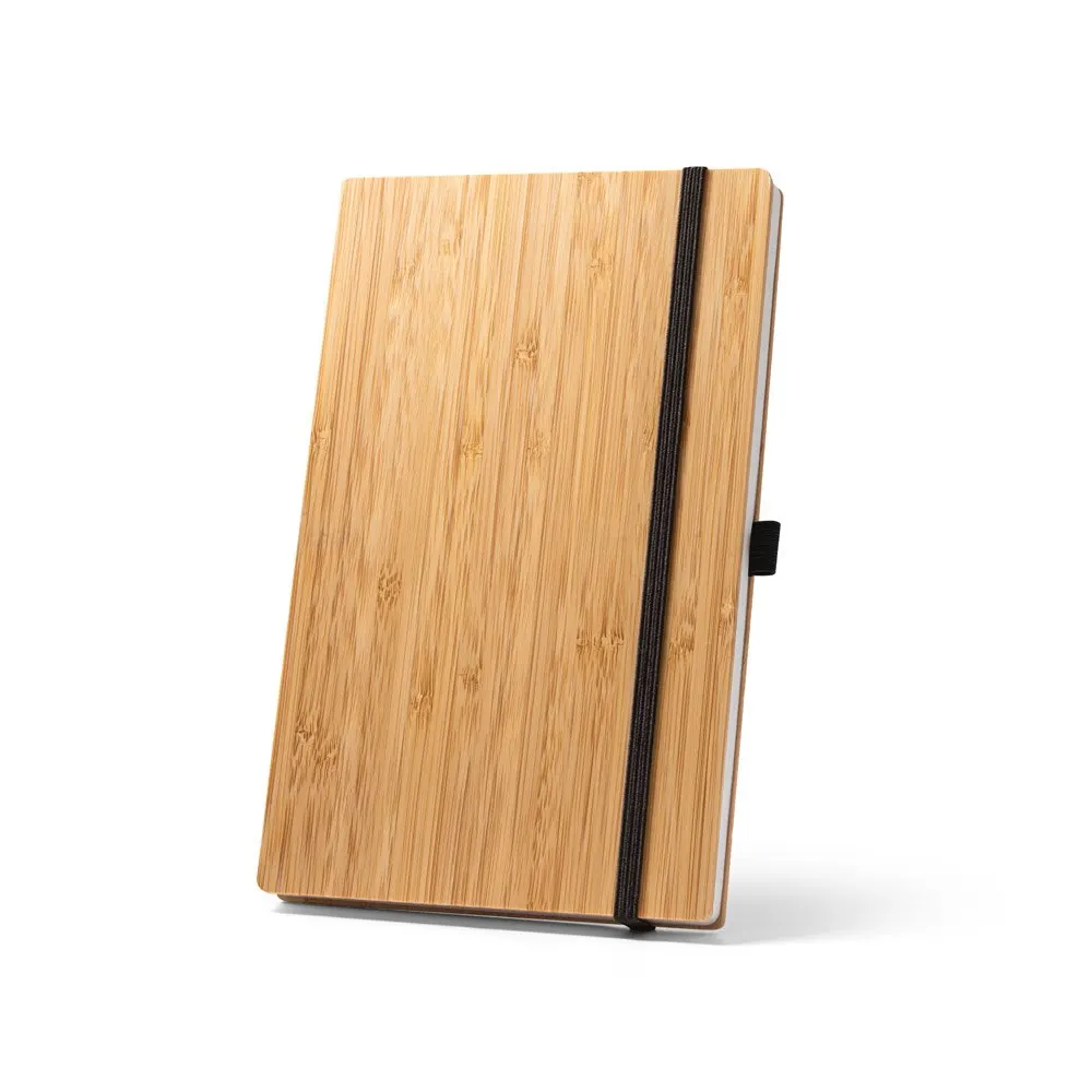 Caderno de bolso com capa e contracapa em placa de bambu e lombada em PET 100% reciclado, com 160 páginas lisas